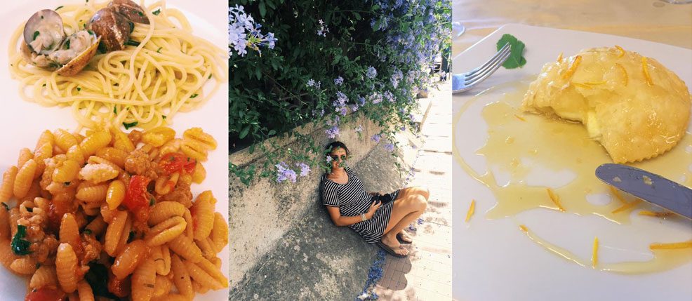 A plate with two different kinds of pasta; a woman sits along a street under a bush of purple flowers; a knife sits by a half-eaten fried pastry filled with cheese and soaked in olive oil 